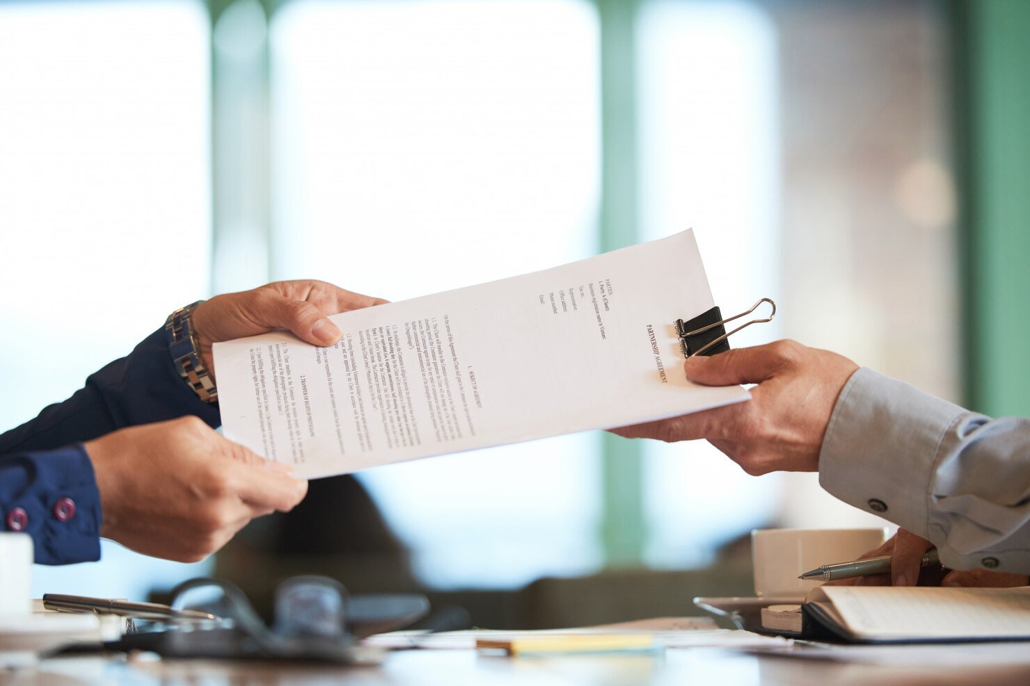 closeup-hands-passing-contract-unrecognizable-businessman_1098-19612.jpg